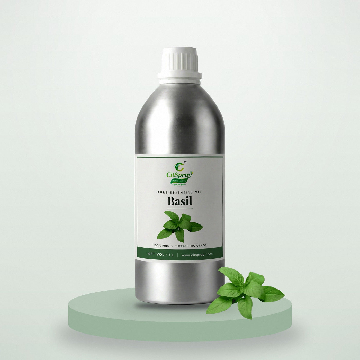 Basil essential oil by CitSpray in a 1 litre aluminium bottle with fresh basil leaves