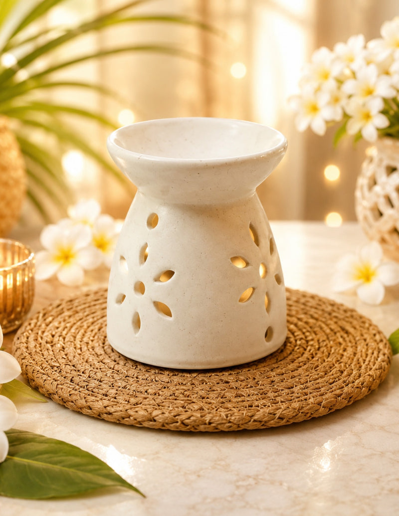 Ivory pedestal ceramic tealight oil diffuser with flower cutouts