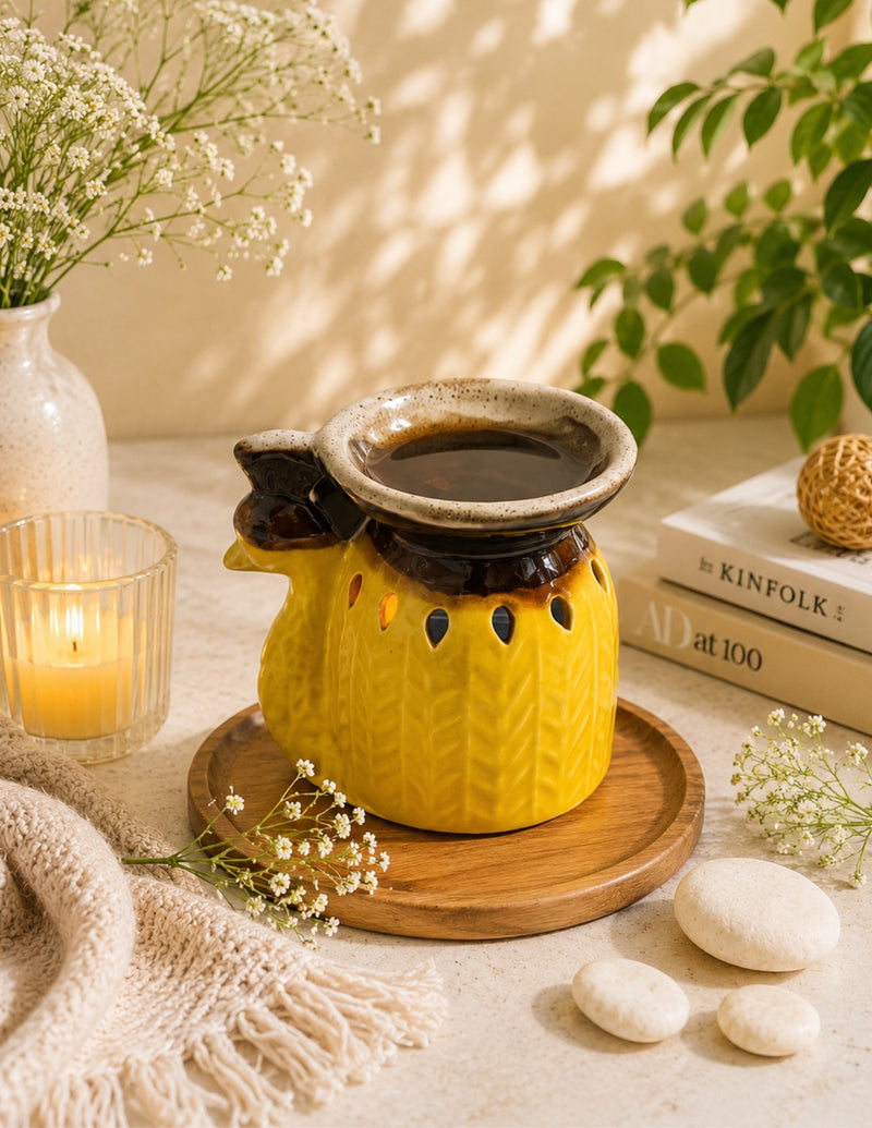 Mustard yellow bird-shaped ceramic tealight essential oil diffuser