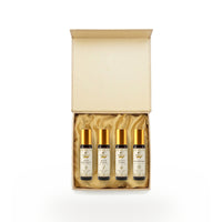Open gift box showing the four aroma roll-ons on gold satin lining thumbnail 2